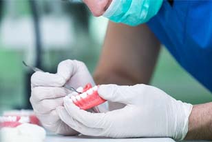 Man in lab creating dentures