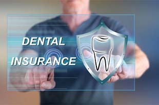Man pointing to dental insurance on screen