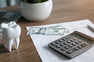 Calculator with money and tooth model