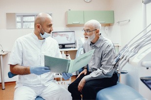 dentist talking to patient