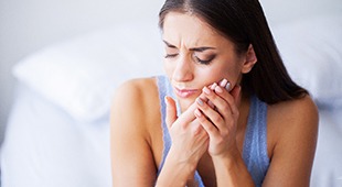 Woman with oral discomfort due to failed dental implant in Deer Park, TX