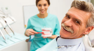 Older Man smiling in dental chair