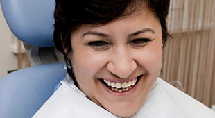 woman smiling in exam chair