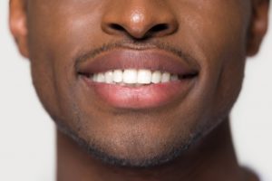 Closeup of smiling man with great oral health and immune system