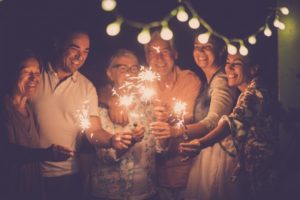 family smiling at new year's eve celebration