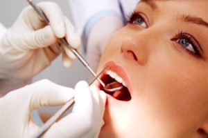 Woman at dentist for cleaning and checkup